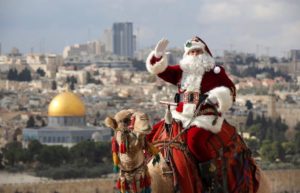 Santa Claus on his camel in the Holy Land